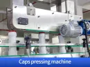 Caps pressing machine